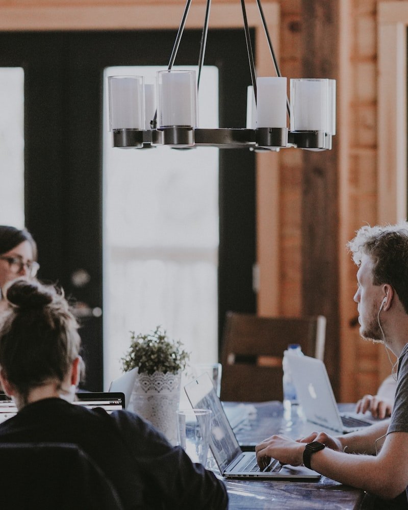 Canadian project management instructors collaborating in a modern training studio